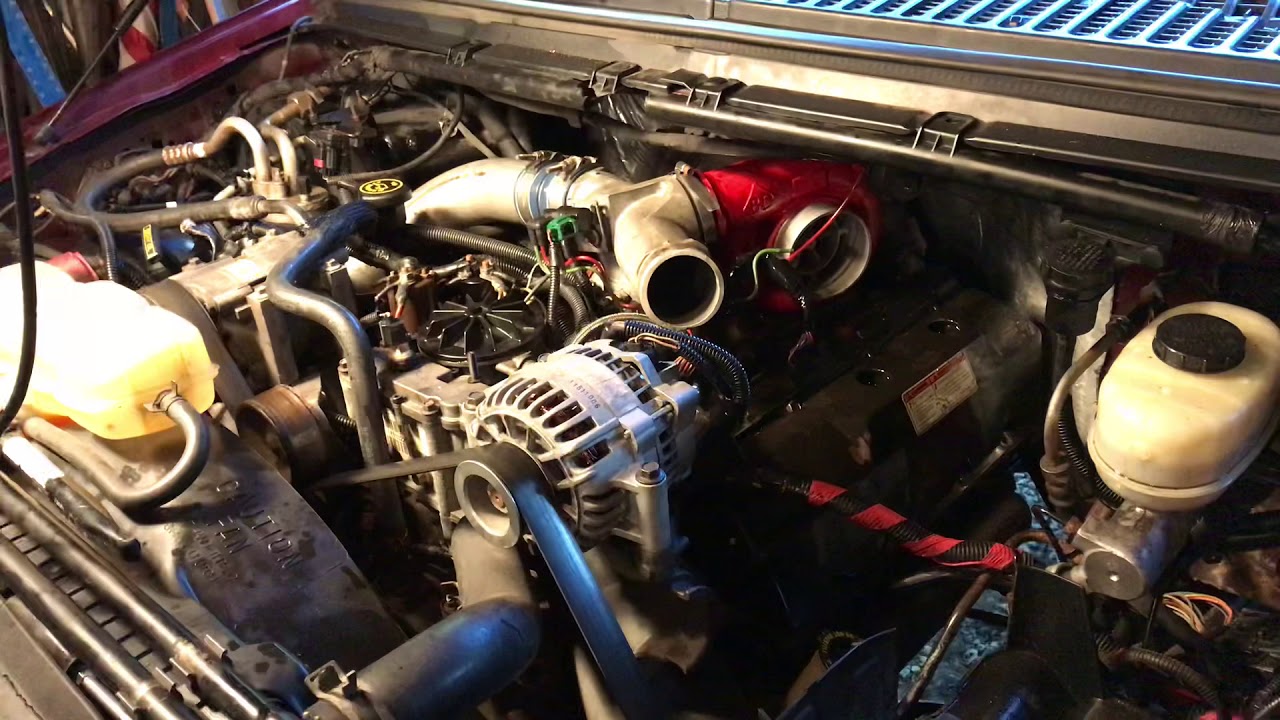 Close view of a 7.3 diesel engine bay during workshop diagnosis